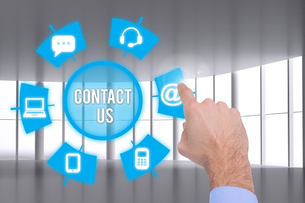 composite of hand pointing at contact us graphics